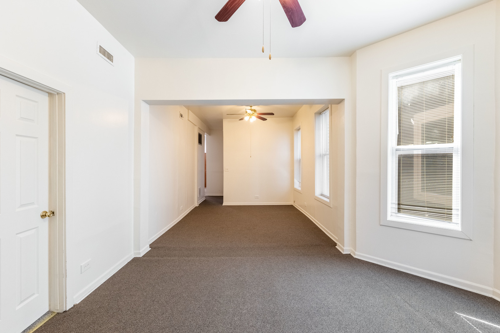 4823 South Indiana Avenue Chicago, IL 60615 - Photo 5 of 30 a view of an empty room with a window