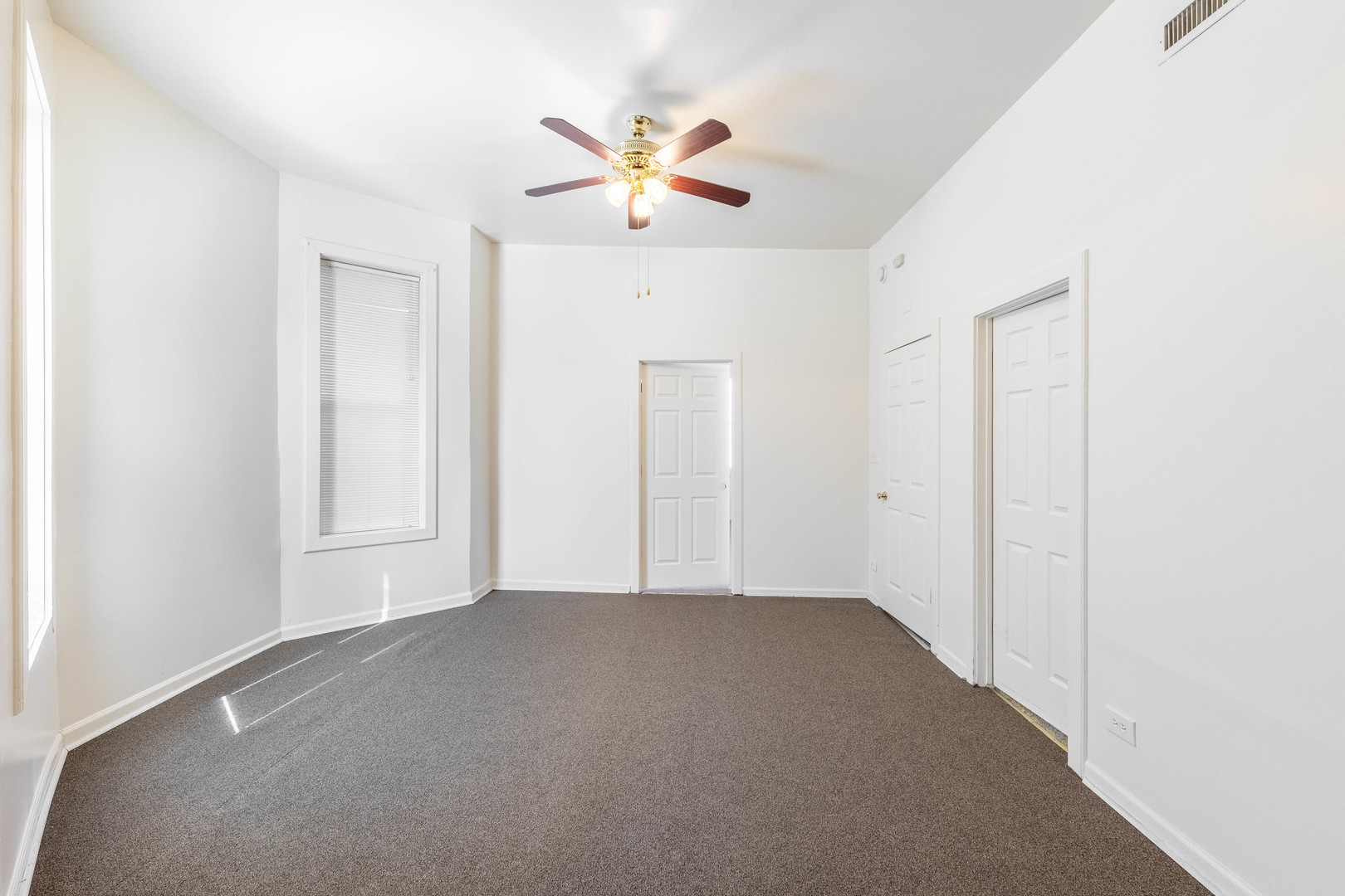 4823 South Indiana Avenue Chicago, IL 60615 - Photo 7 of 30 a view of an empty room with a window