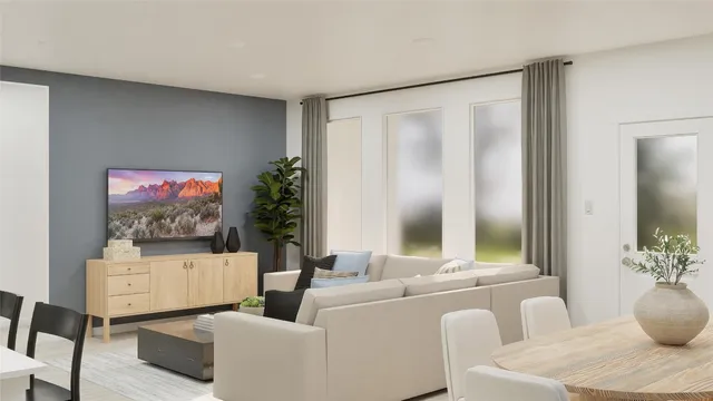 a living room with furniture and a potted plant