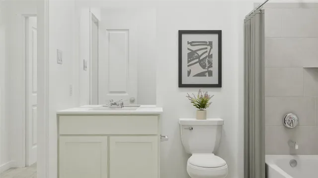 a bathroom with a toilet a sink and a bathtub
