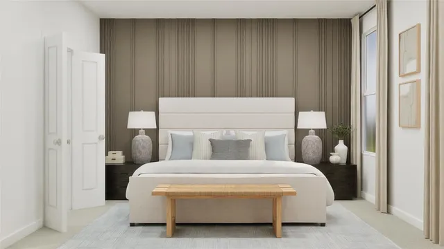 a bedroom with bed and a potted plant