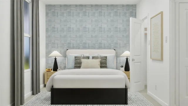 a bedroom with a bed and a night stand