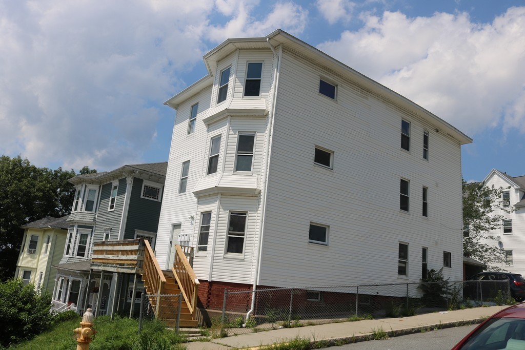 69 Catharine Street, Unit 3 Worcester, MA 01605 - Photo 17 of 17 a front view of residential houses with street