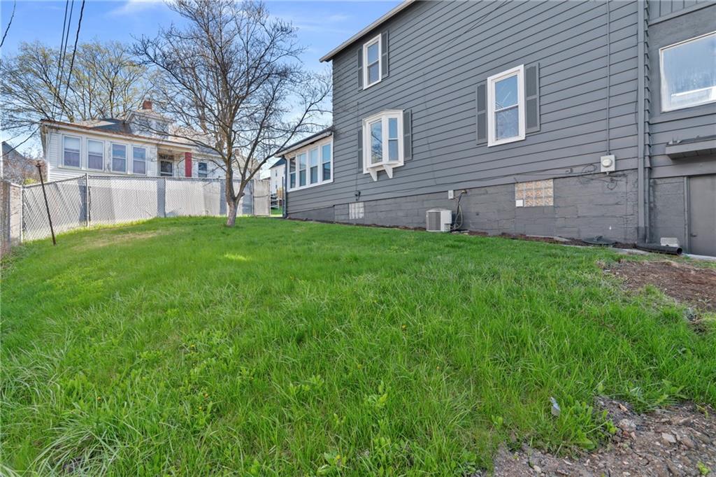 711 9th Avenue Irwin, PA 15642 - Photo 25 of 26 a brick building with a yard