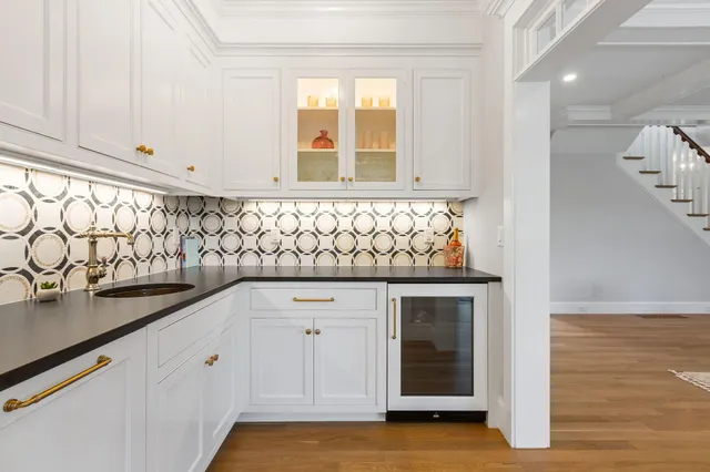 a bathroom with a sink and a mirror with toilet