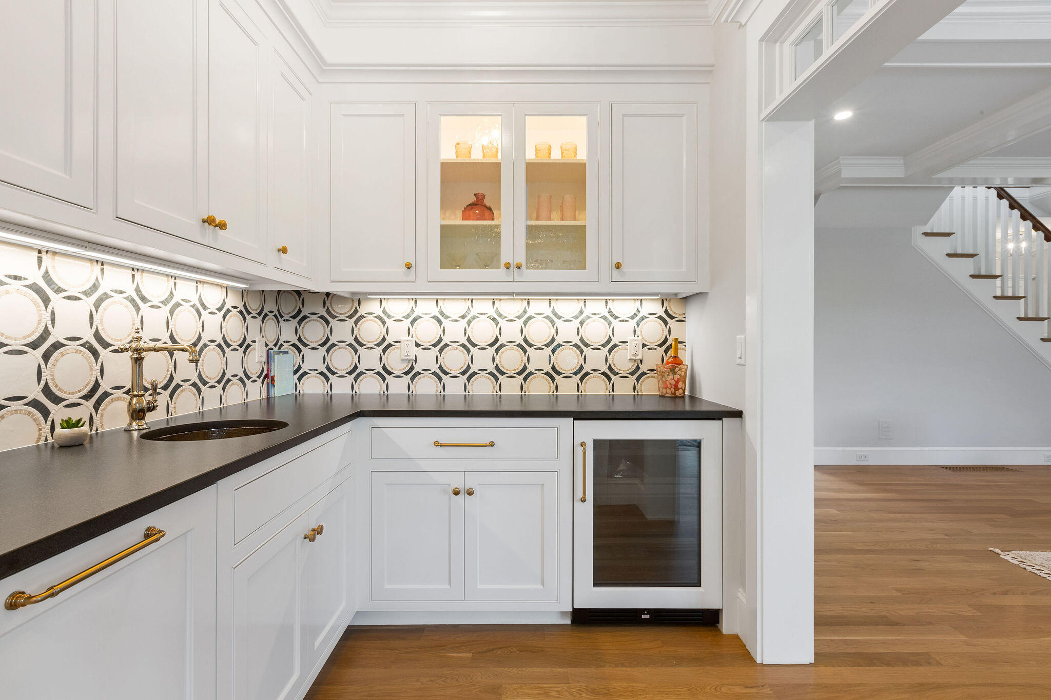 63 Kescayogansett Road Orleans, MA 02653 - Photo 27 of 92 a view of a kitchen with white cabinets and a sink