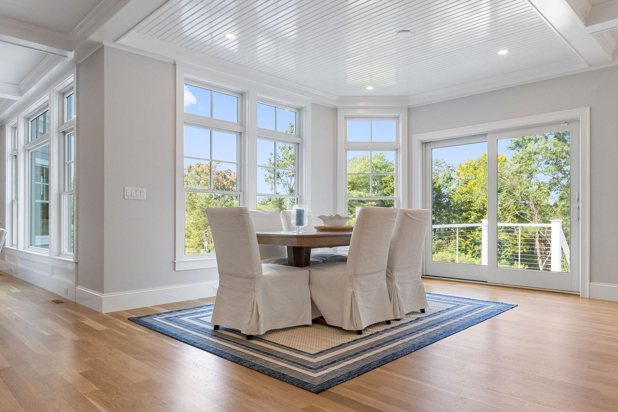 63 Kescayogansett Road Orleans, MA 02653 - Photo 38 of 92 a dining room with wooden floor