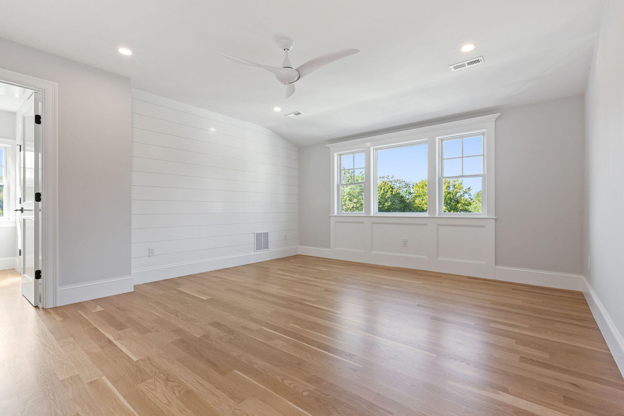 63 Kescayogansett Road Orleans, MA 02653 - Photo 74 of 92 an empty room with wooden floor and windows