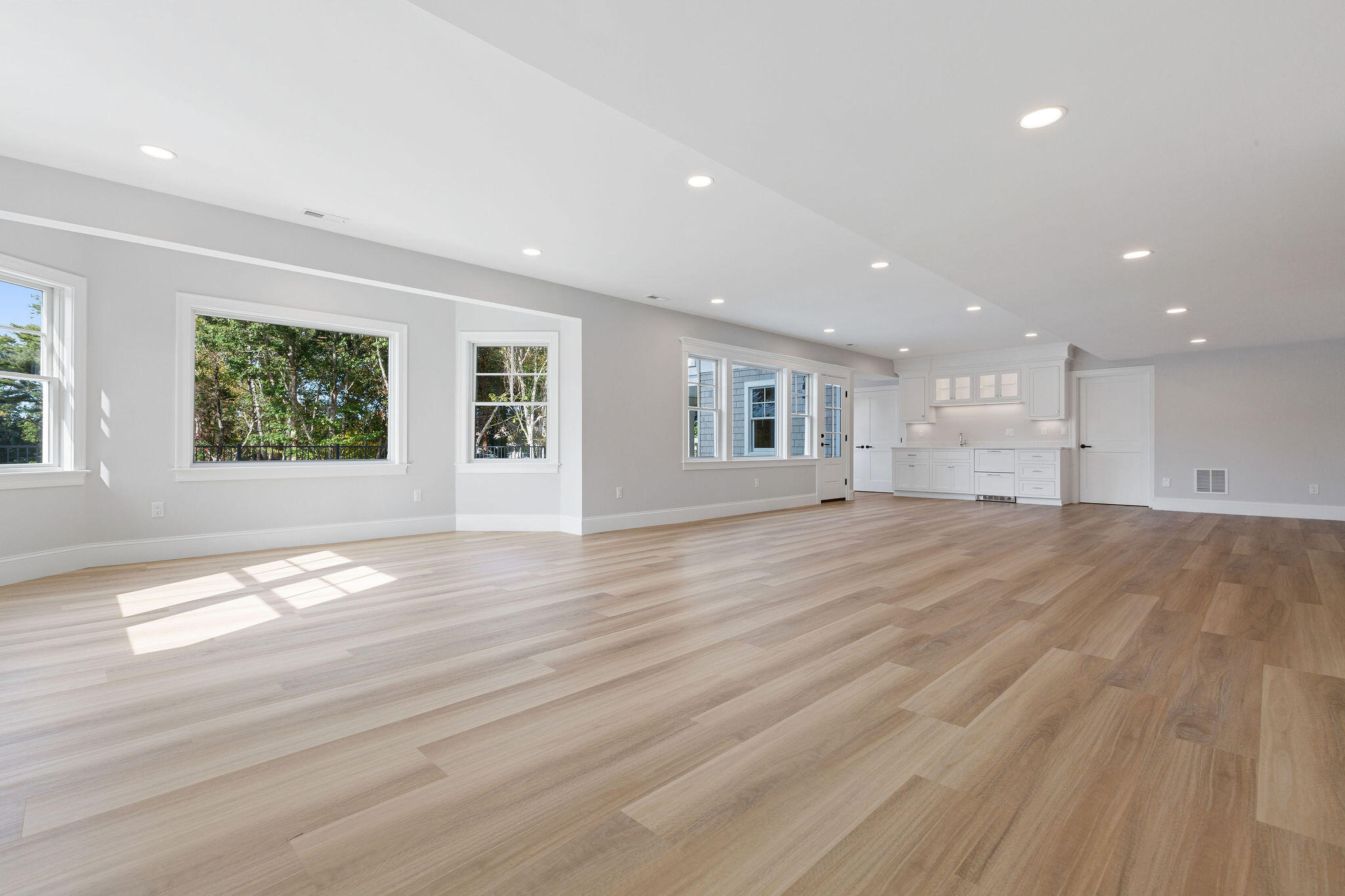 63 Kescayogansett Road Orleans, MA 02653 - Photo 80 of 92 a view of an empty room with wooden floor and a window