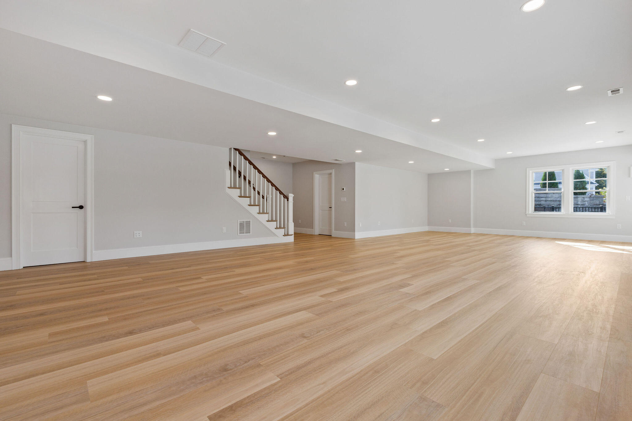 63 Kescayogansett Road Orleans, MA 02653 - Photo 83 of 92 a view of an empty room with wooden floor and a window