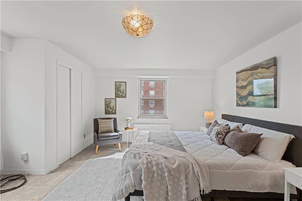 4601 Fifth Avenue, Unit 327 Pittsburgh, PA 15213 - Photo 11 of 25 a bedroom with a bed and a table in it