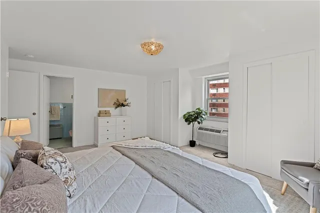 a bedroom with a bed and a cabinets