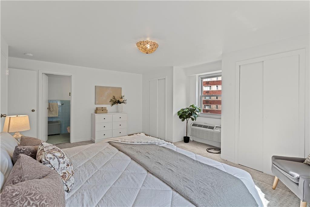 4601 Fifth Avenue, Unit 327 Pittsburgh, PA 15213 - Photo 12 of 25 a bedroom with a bed and a cabinets