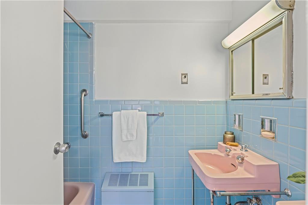 4601 Fifth Avenue, Unit 327 Pittsburgh, PA 15213 - Photo 13 of 25 a bathroom with a sink and a mirror