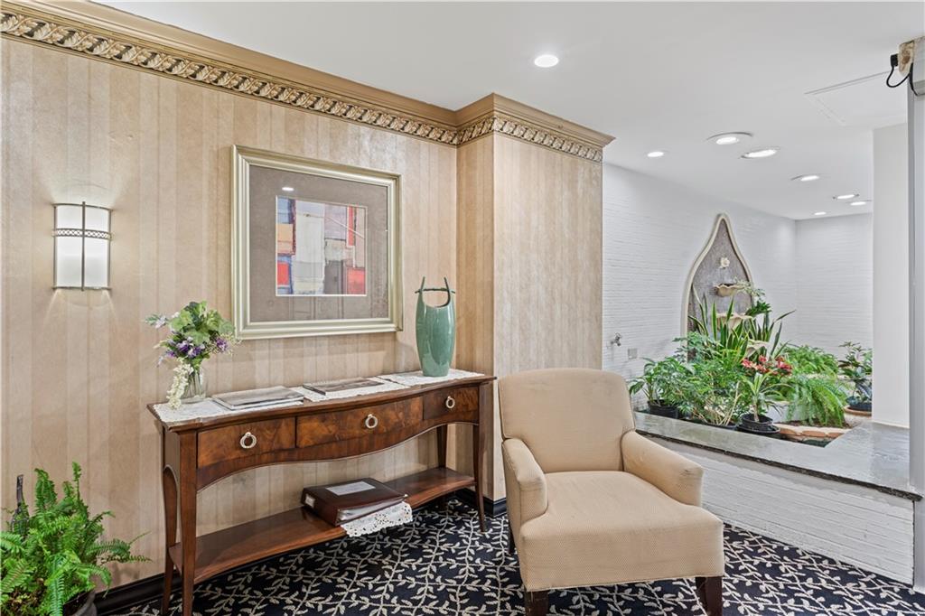 4601 Fifth Avenue, Unit 327 Pittsburgh, PA 15213 - Photo 19 of 25 a room with a couch and potted plant