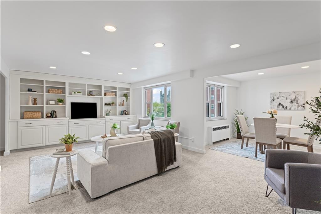 4601 Fifth Avenue, Unit 327 Pittsburgh, PA 15213 - Photo 3 of 25 a living room with furniture and a flat screen tv