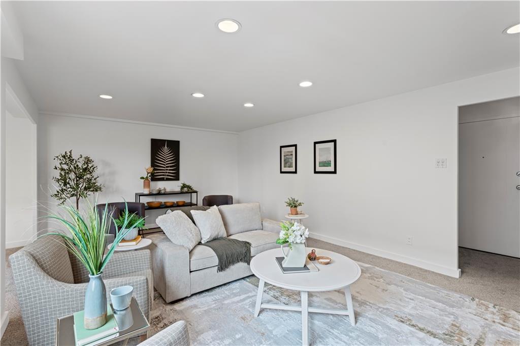 4601 Fifth Avenue, Unit 327 Pittsburgh, PA 15213 - Photo 6 of 25 a living room with furniture and a wooden floor