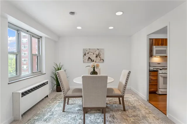 a dining room with furniture and window