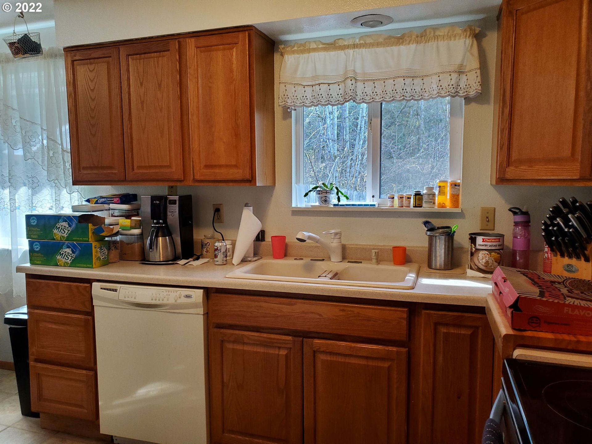 30431 South Deardorff Road Molalla, OR 97038 - Photo 6 of 32 a kitchen with a sink a cabinets and window