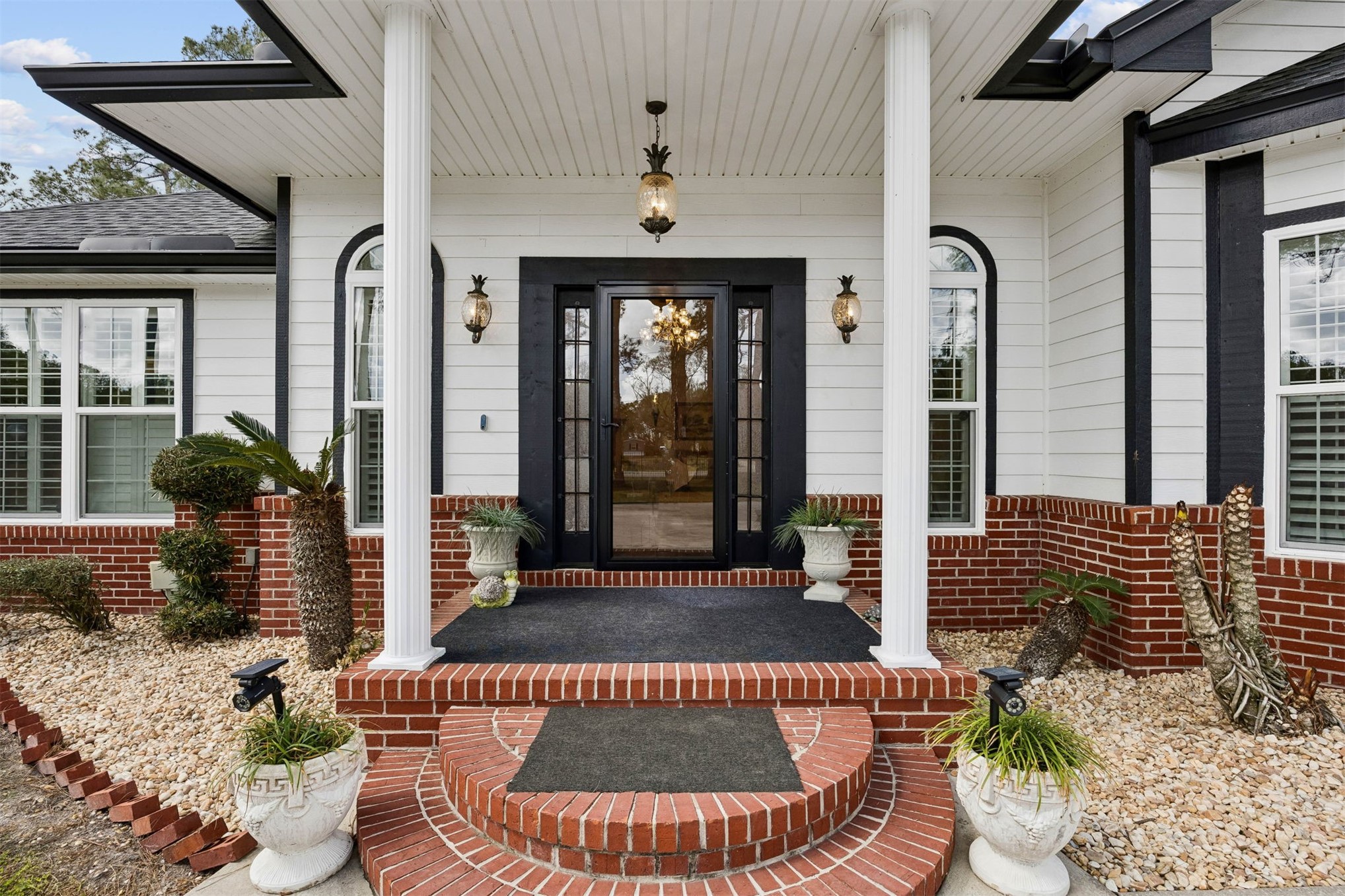 376488 Kings Ferry Road Hilliard, FL 32046 - Photo 15 of 73 a front view of a house with a porch