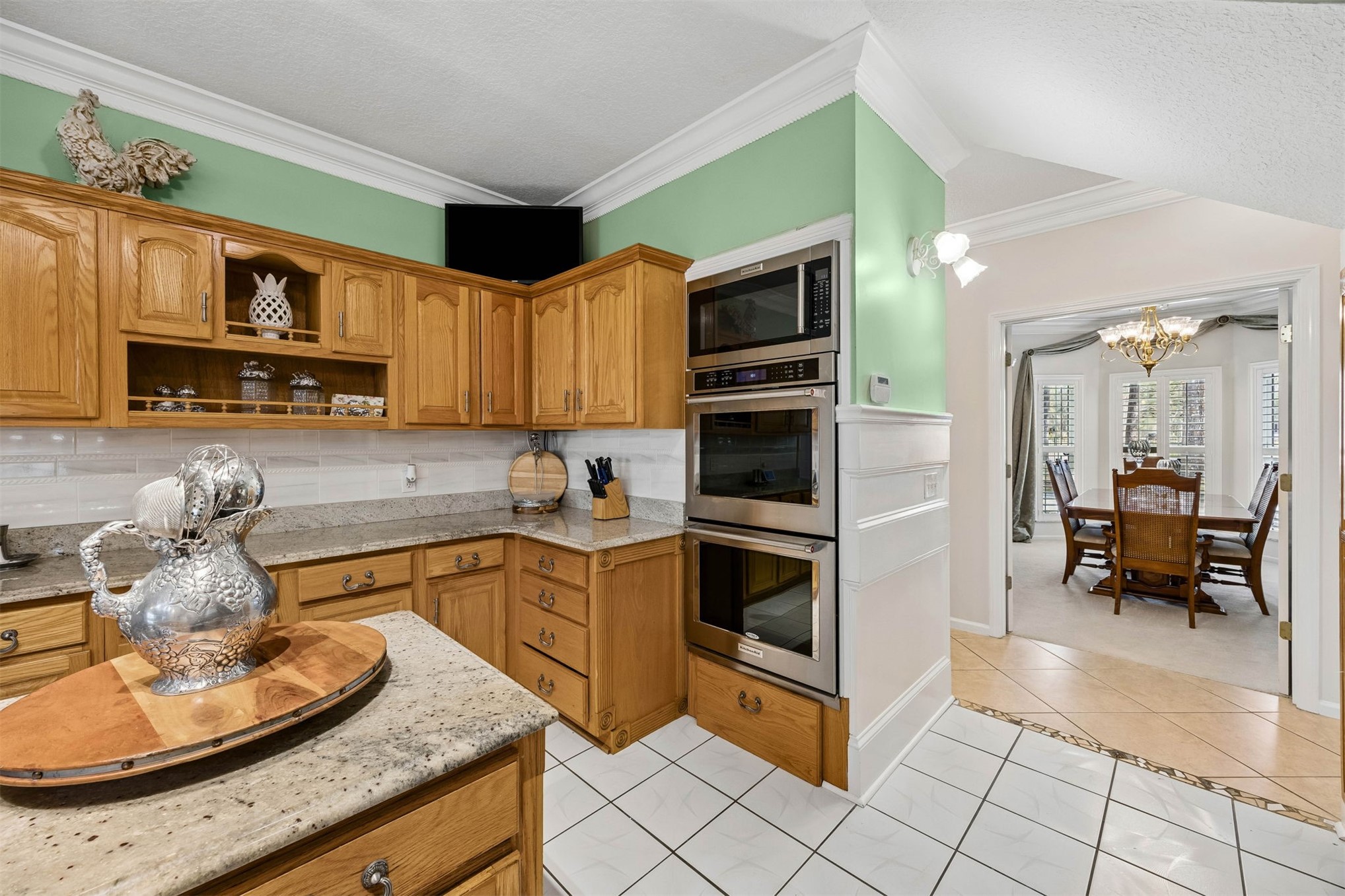 376488 Kings Ferry Road Hilliard, FL 32046 - Photo 23 of 73 a kitchen with granite countertop a sink cabinets and stainless steel appliances
