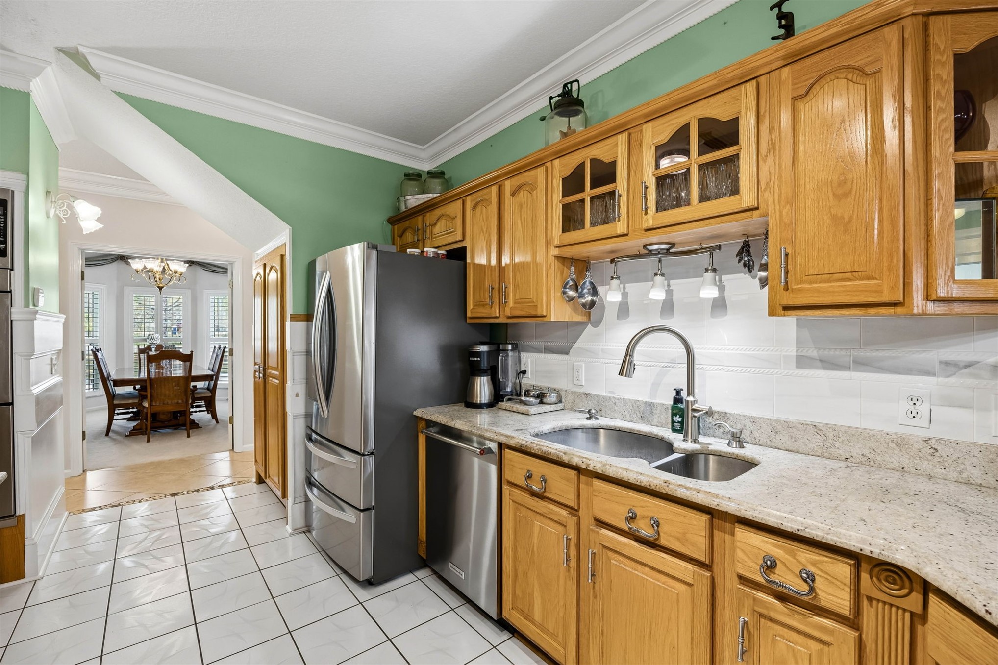 376488 Kings Ferry Road Hilliard, FL 32046 - Photo 25 of 73 a kitchen with stainless steel appliances granite countertop a refrigerator and a sink