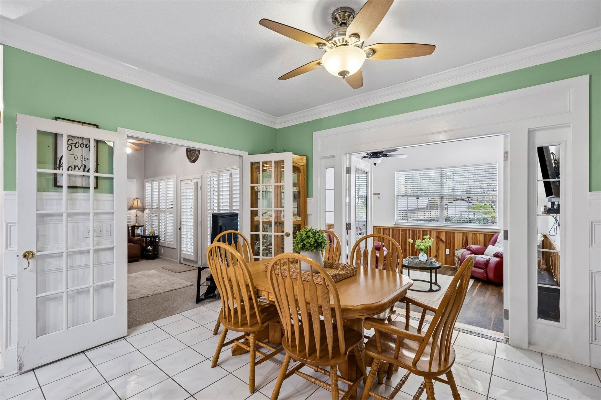 376488 Kings Ferry Road Hilliard, FL 32046 - Photo 27 of 73 a dining room with furniture and a floor to ceiling window