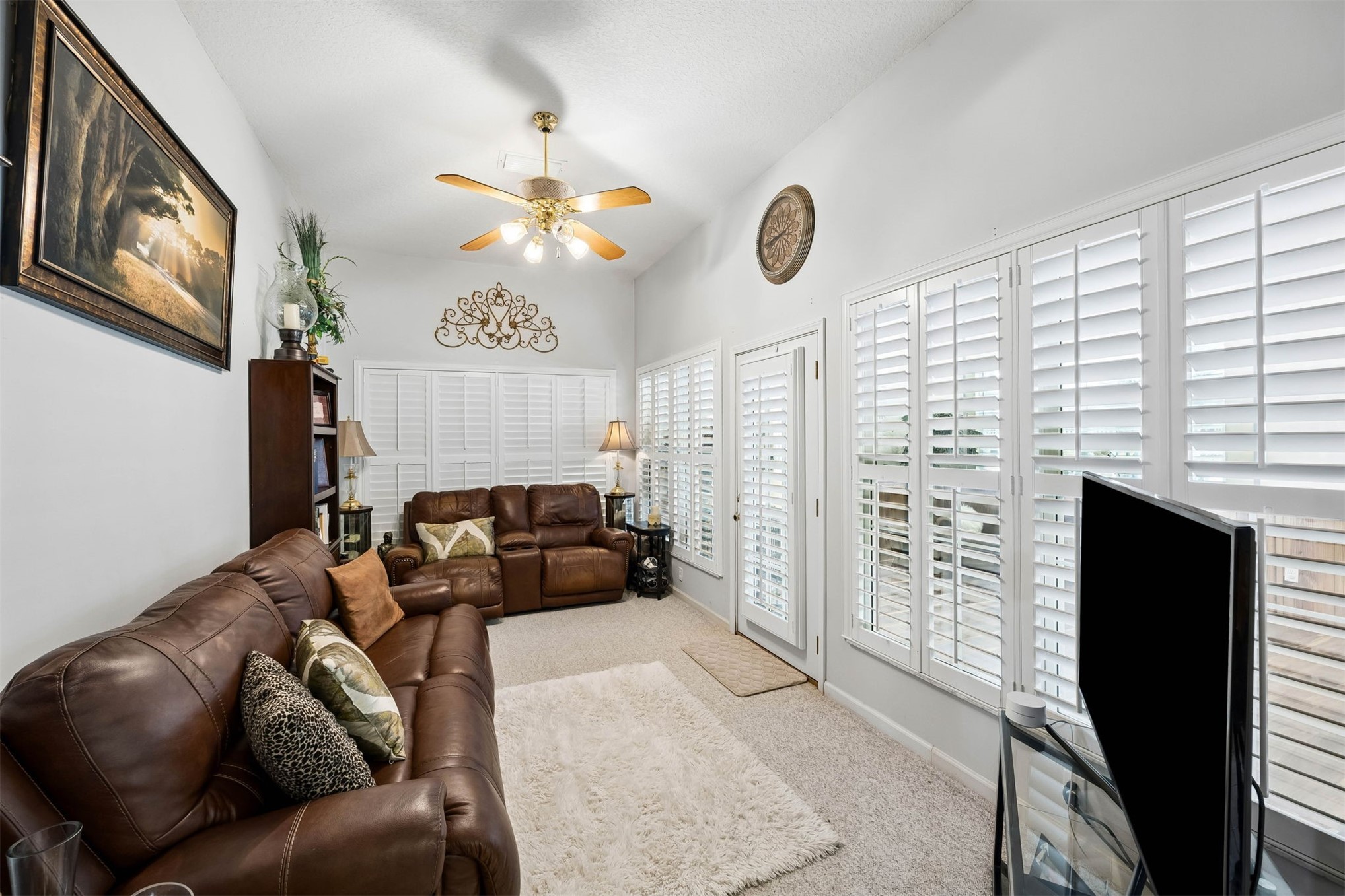 376488 Kings Ferry Road Hilliard, FL 32046 - Photo 29 of 73 a living room with furniture a fireplace and a window