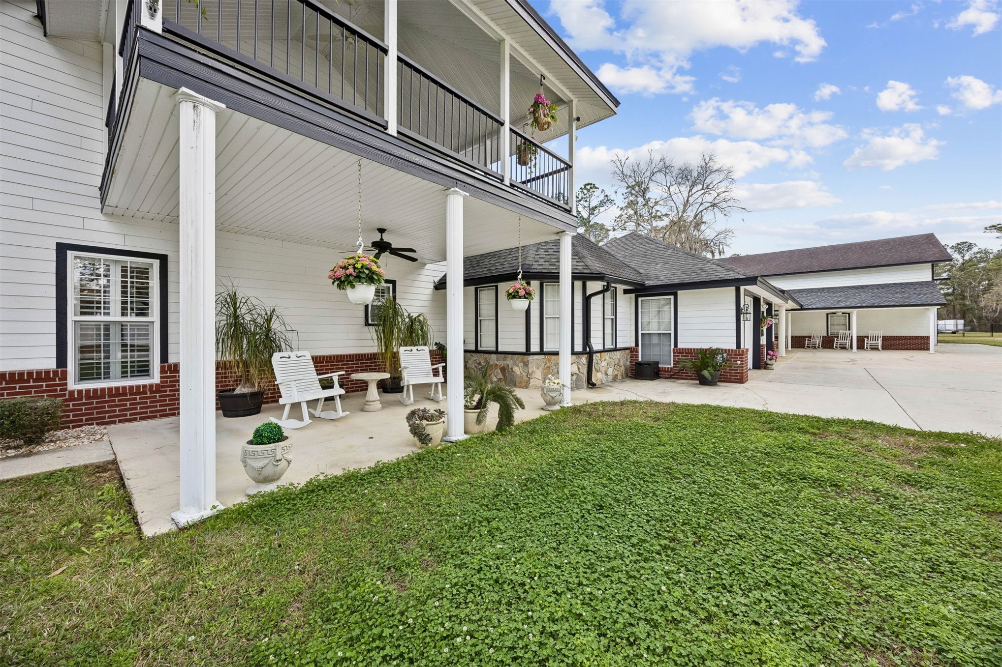 376488 Kings Ferry Road Hilliard, FL 32046 - Photo 57 of 73 a view of a house with backyard porch and sitting area