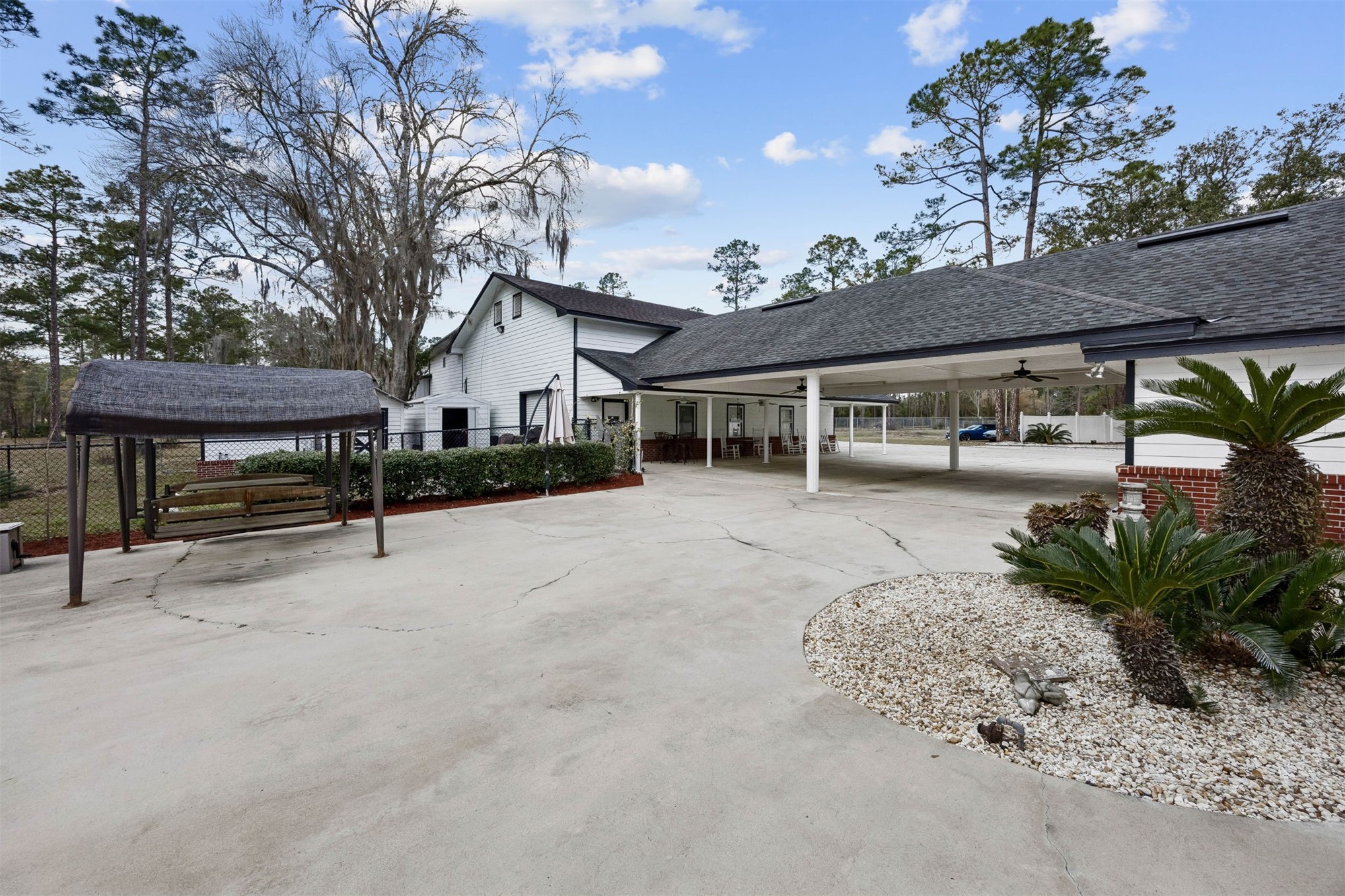 376488 Kings Ferry Road Hilliard, FL 32046 - Photo 59 of 73 a view of house with outdoor seating and covered with trees