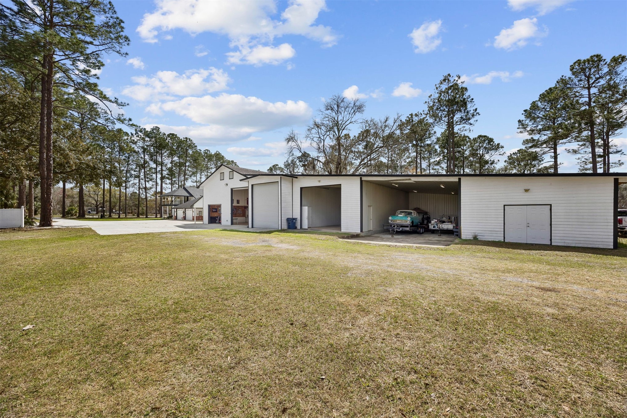 376488 Kings Ferry Road Hilliard, FL 32046 - Photo 63 of 73 a front view of house with yard and trees
