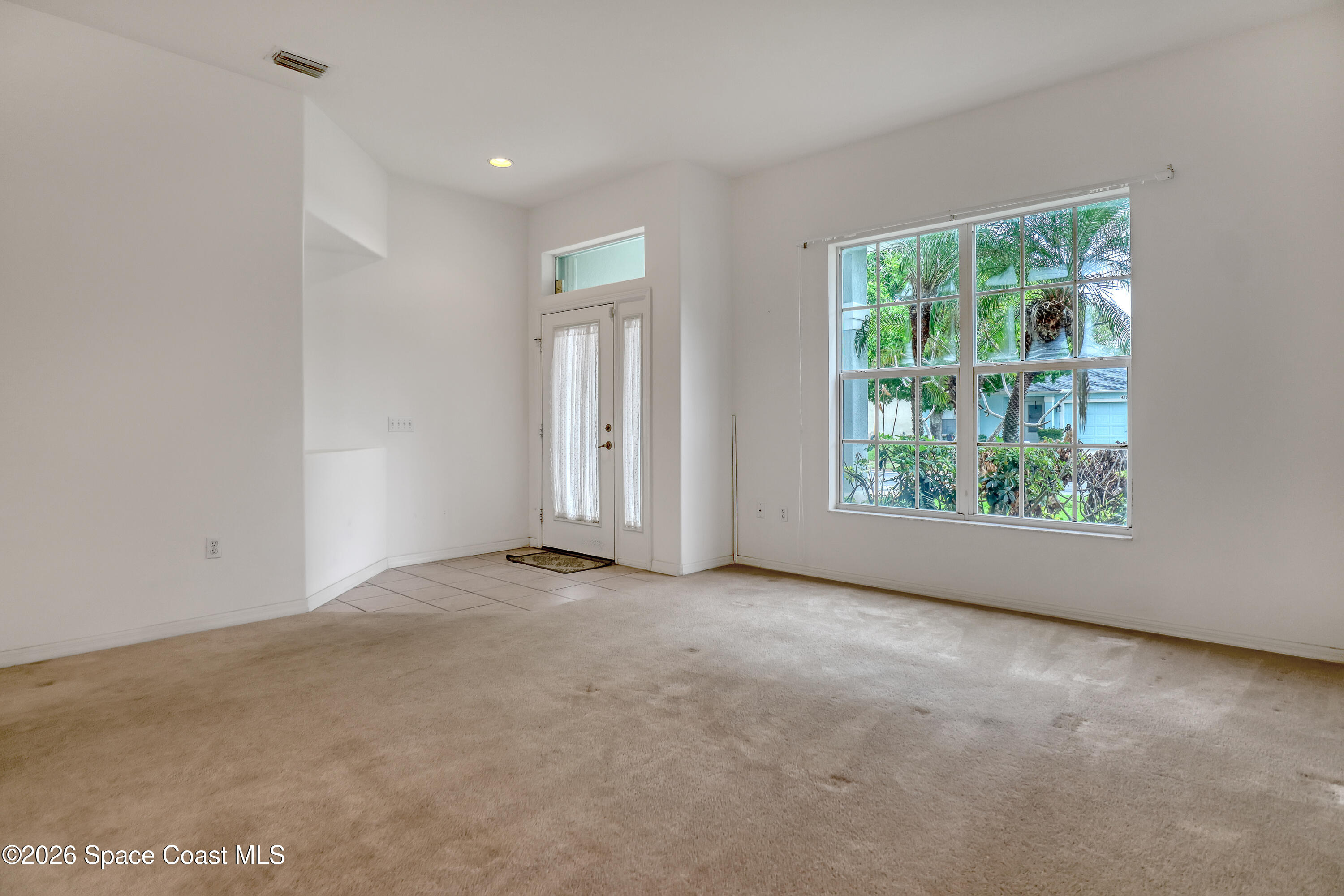 4892 Outlook Drive Melbourne, FL 32940 - Photo 12 of 34 a view of an empty room with a window