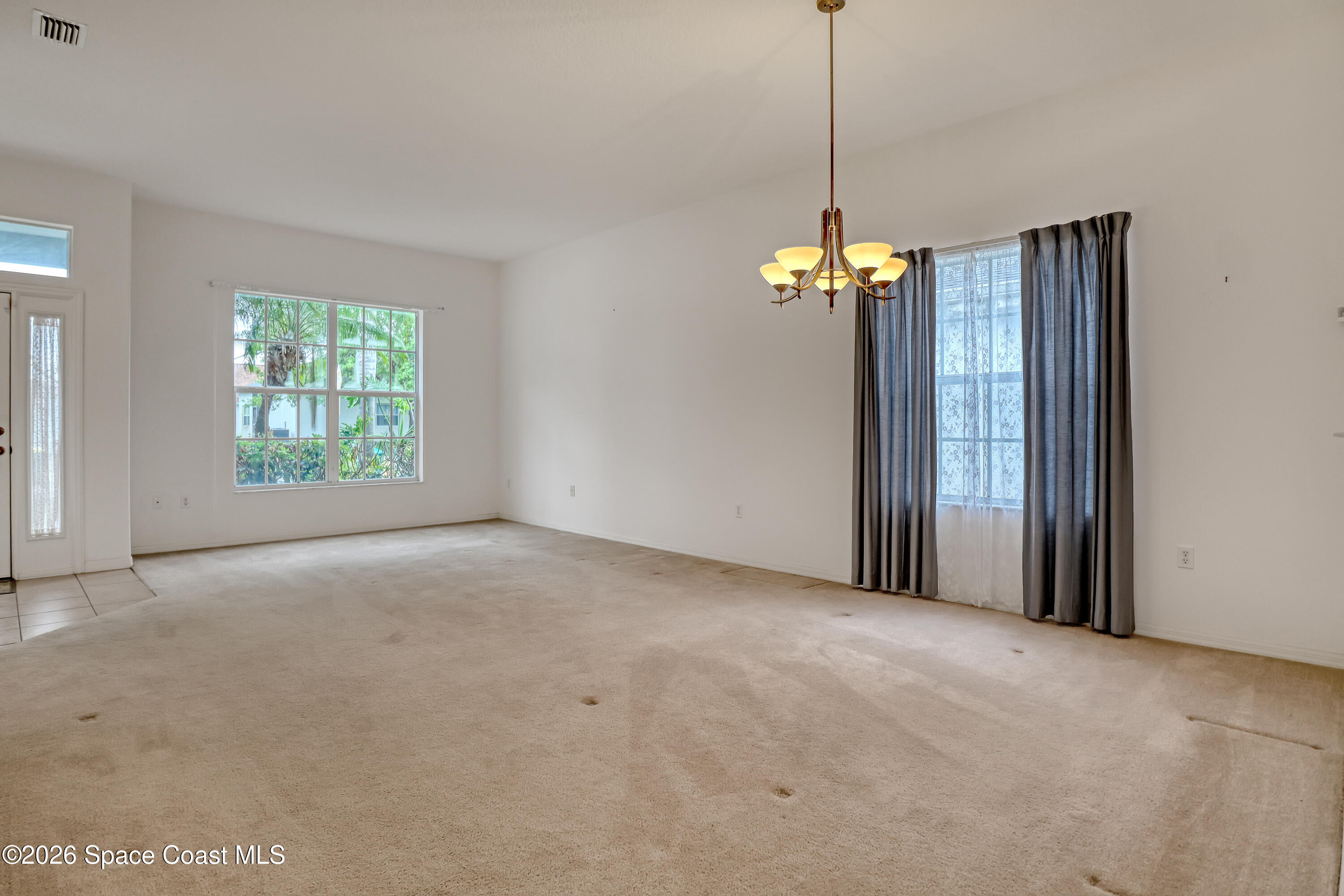 4892 Outlook Drive Melbourne, FL 32940 - Photo 14 of 34 a view of a room with window wooden floor