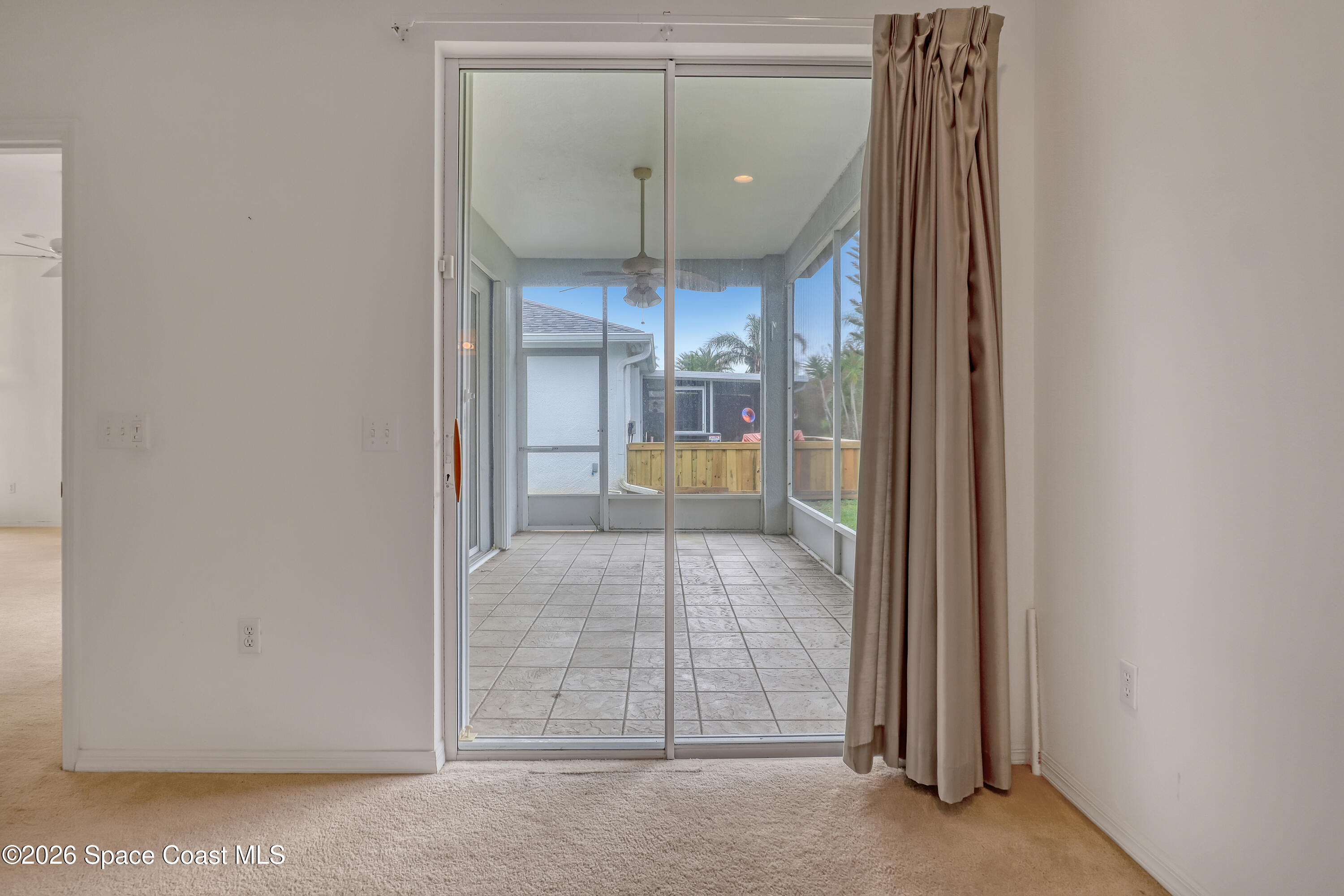4892 Outlook Drive Melbourne, FL 32940 - Photo 18 of 34 a view of a hallway with wooden floor and staircase