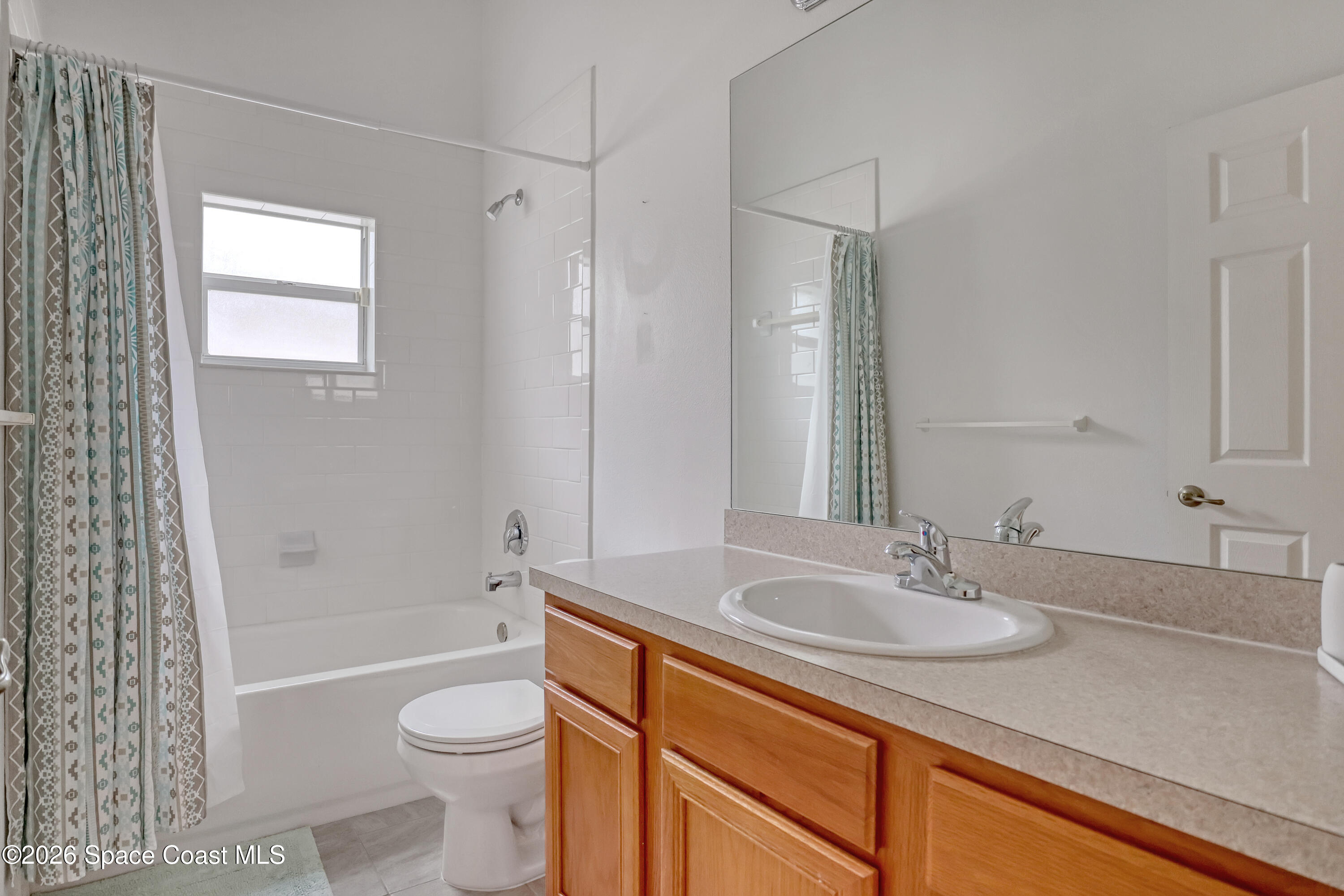 4892 Outlook Drive Melbourne, FL 32940 - Photo 24 of 34 a bathroom with a sink toilet and shower