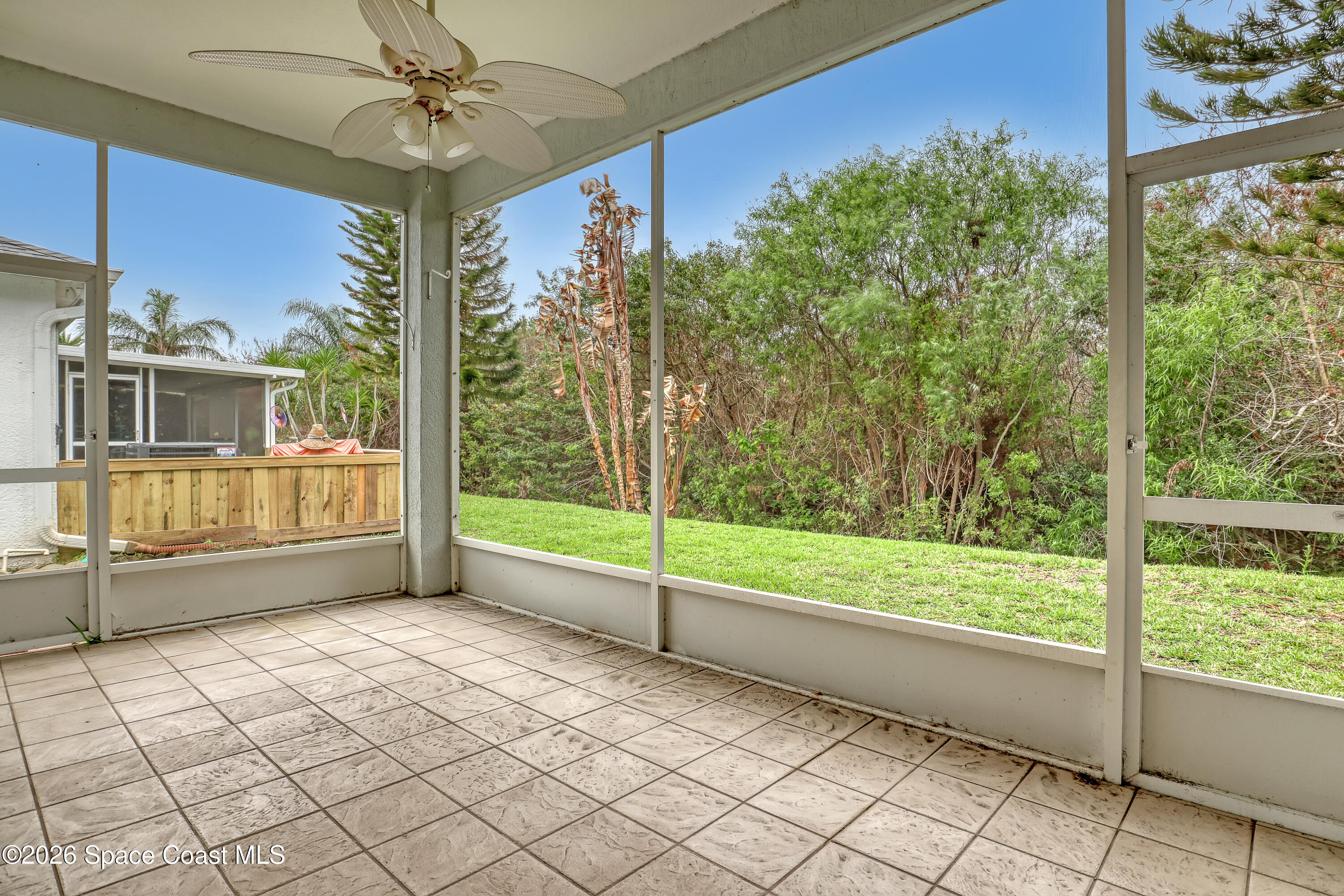 4892 Outlook Drive Melbourne, FL 32940 - Photo 27 of 34 a view of empty room with wooden floor and fan