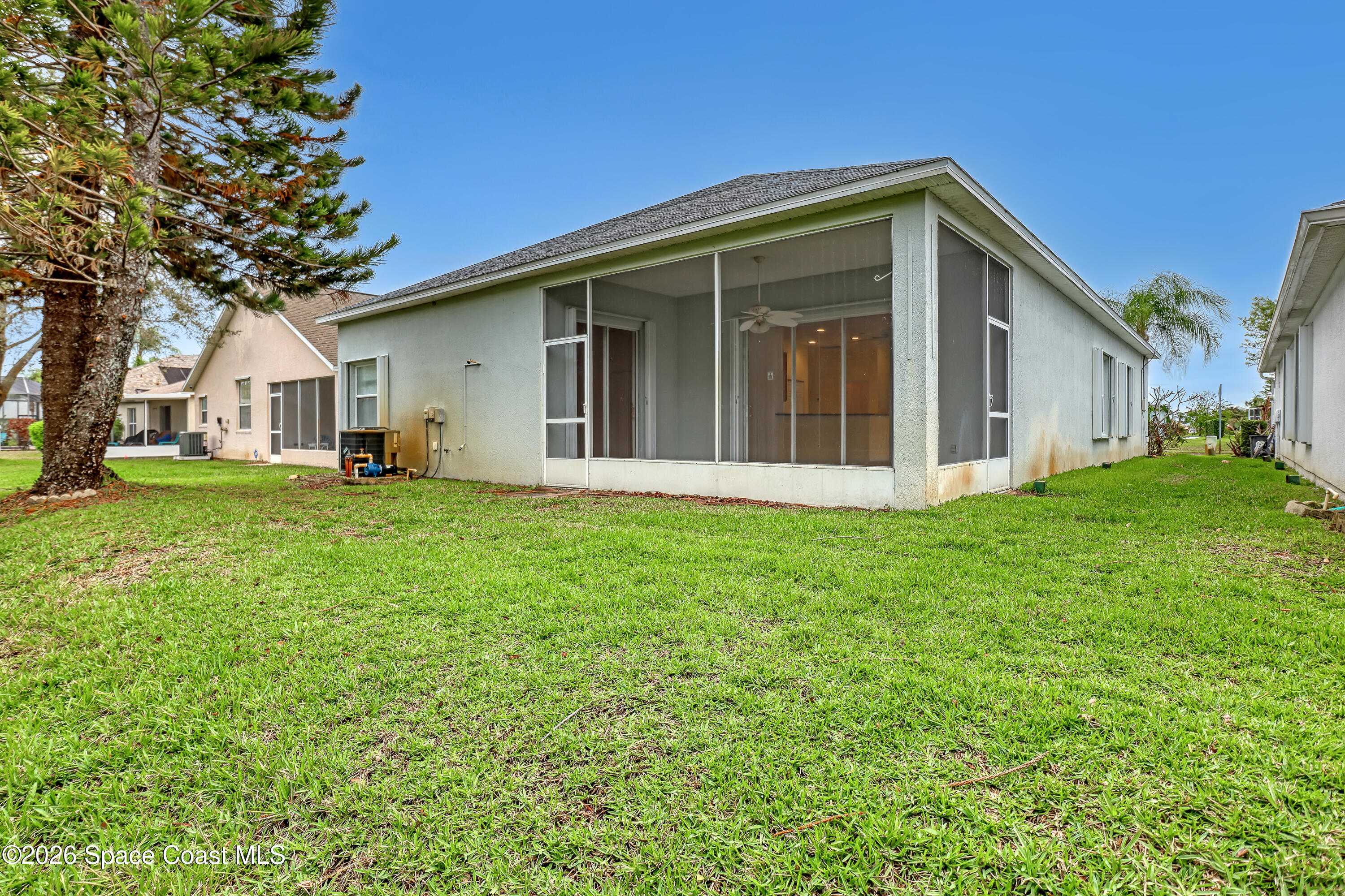 4892 Outlook Drive Melbourne, FL 32940 - Photo 31 of 34 a front view of house with yard and green space