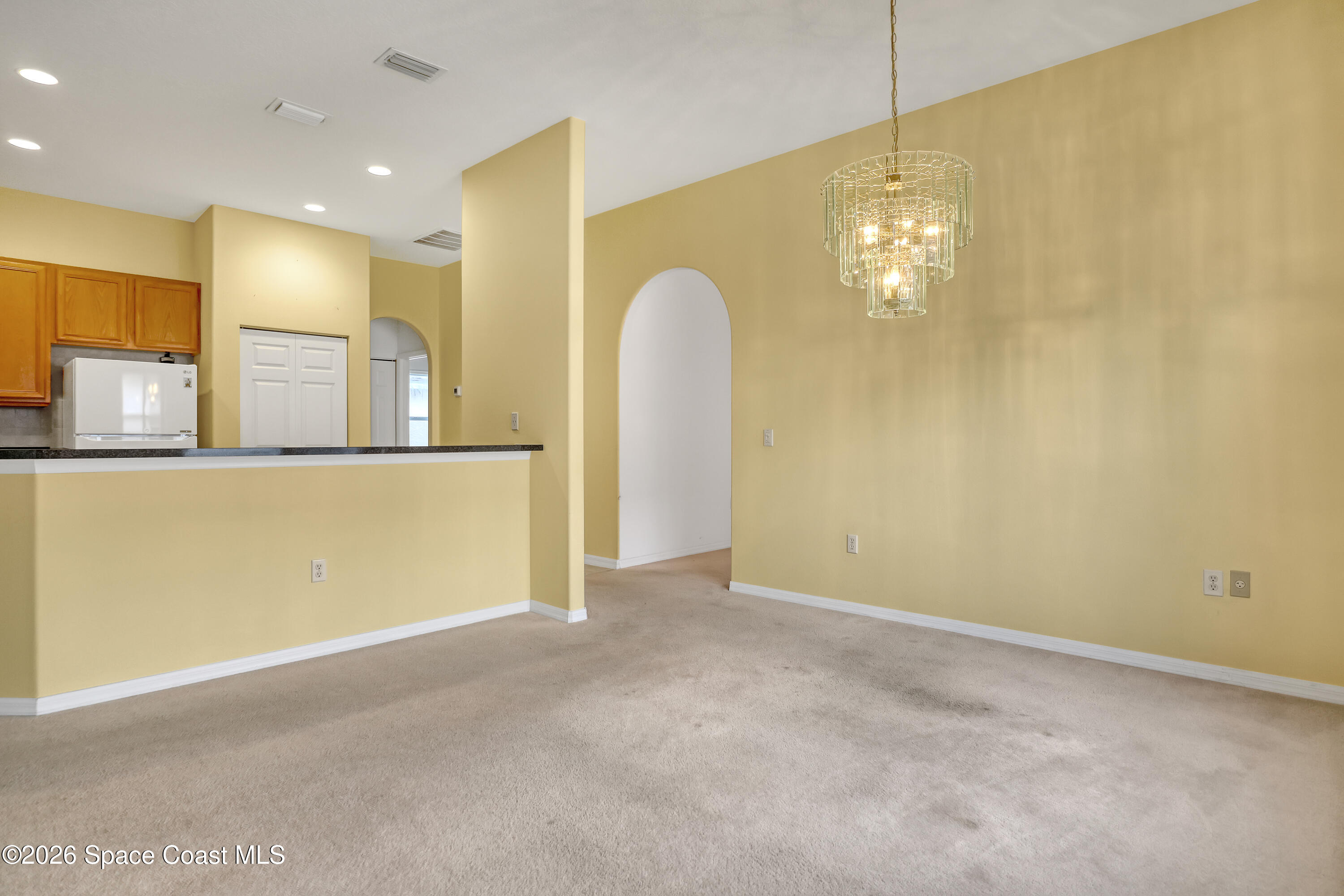 4892 Outlook Drive Melbourne, FL 32940 - Photo 7 of 34 a view of a livingroom with a kitchen