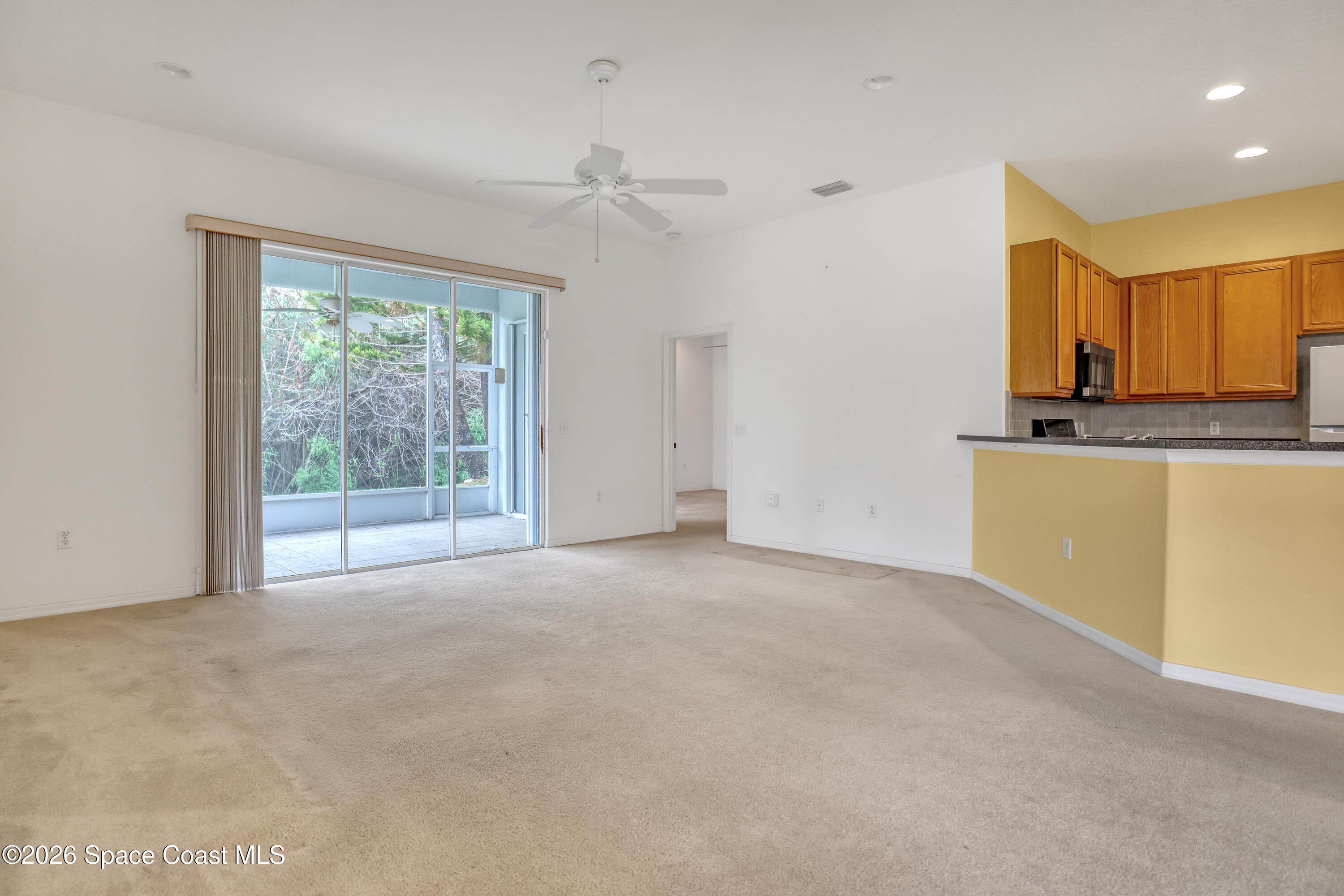4892 Outlook Drive Melbourne, FL 32940 - Photo 8 of 34 a view of an empty room with a window