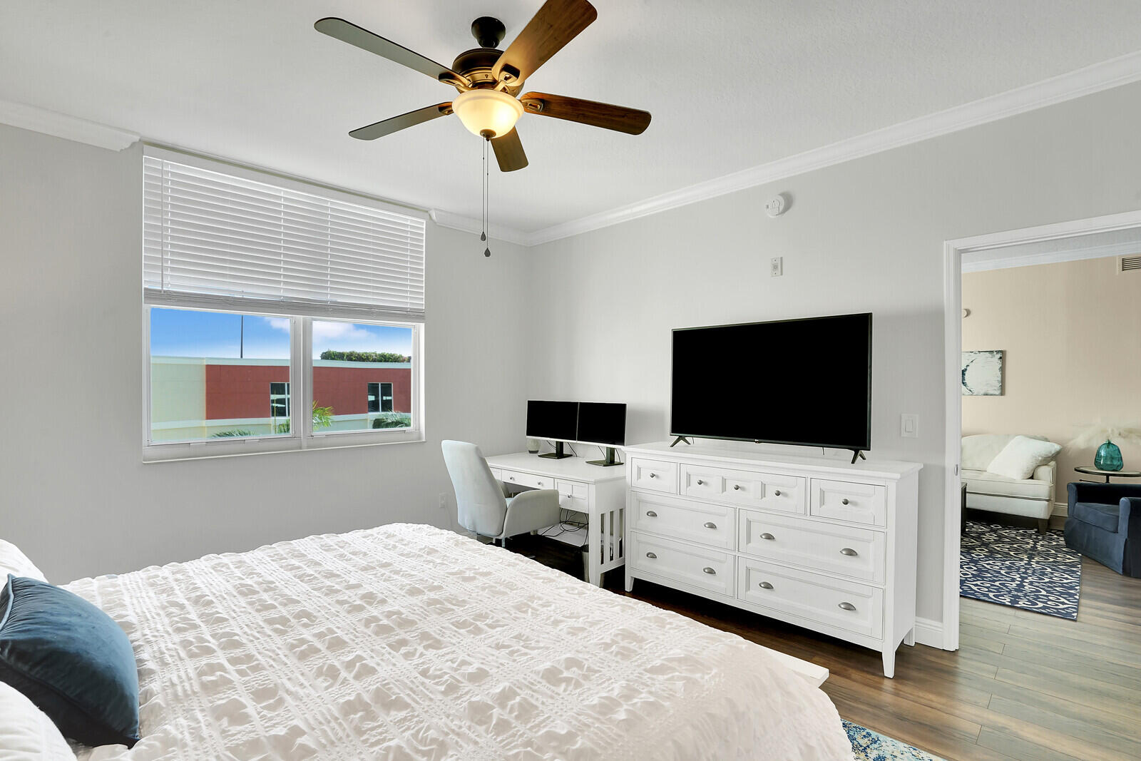 804 East Windward Way, Unit 608 Lantana, FL 33462 - Photo 15 of 33 a bedroom with a bed and a flat screen tv