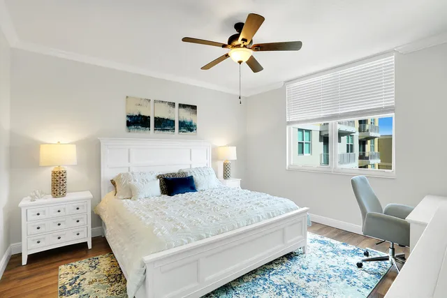 a bedroom with a large bed and a window