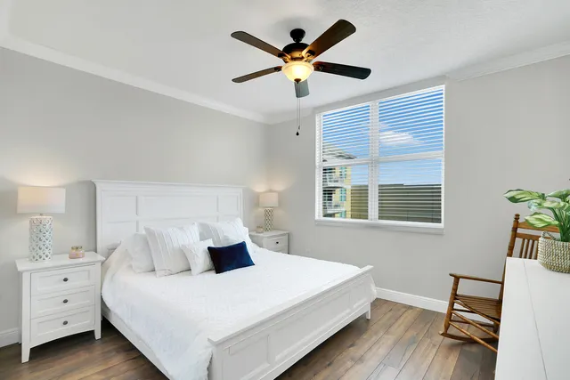 a bed room with bed and window