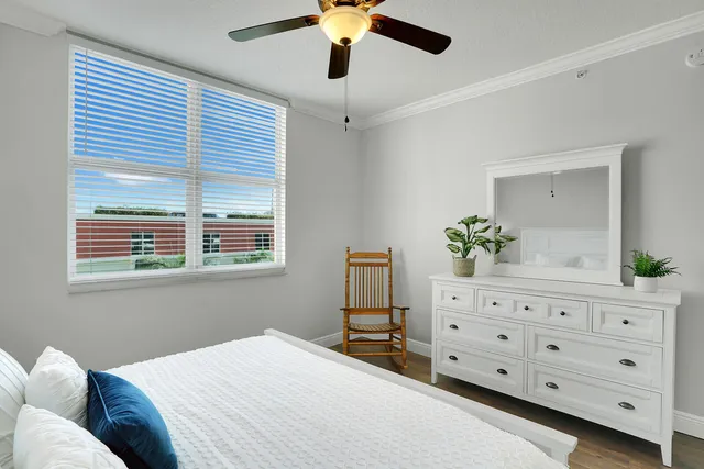 a bedroom with a bed and a dresser