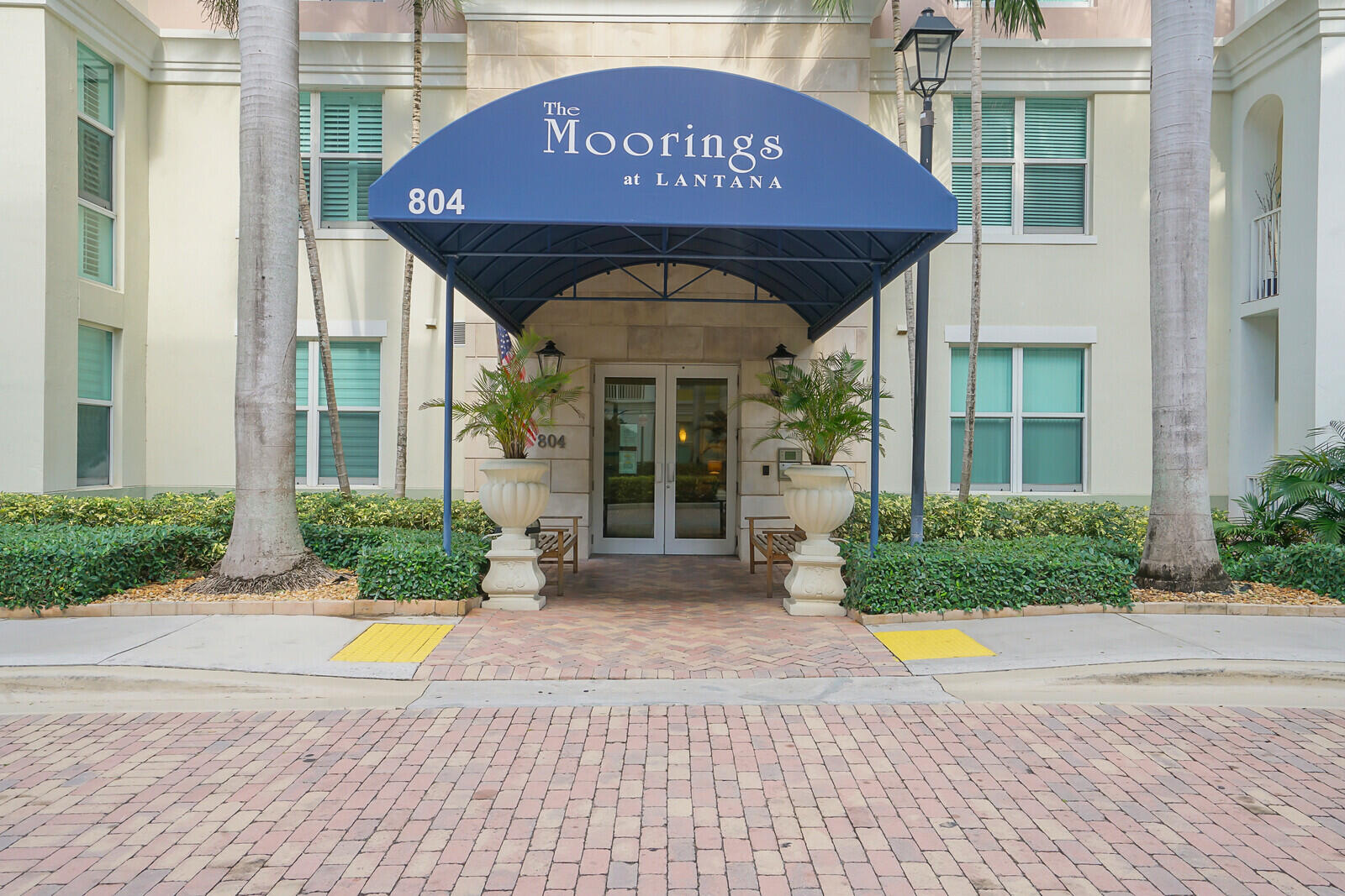 804 East Windward Way, Unit 608 Lantana, FL 33462 - Photo 2 of 33 a front view of a house with garden