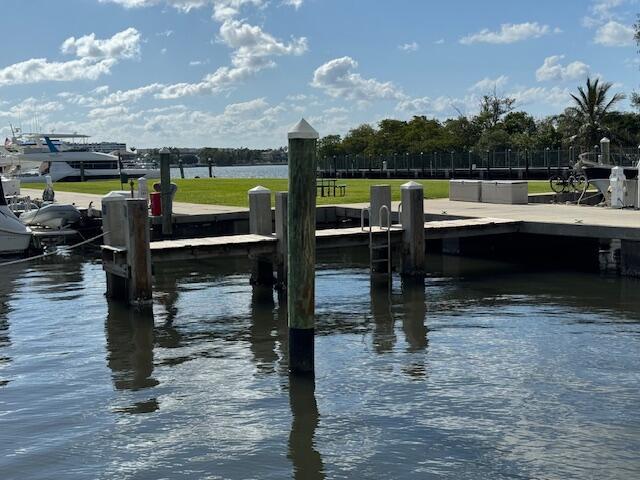 804 East Windward Way, Unit 608 Lantana, FL 33462 - Photo 32 of 33 a view of a swimming pool with a lounge chairs