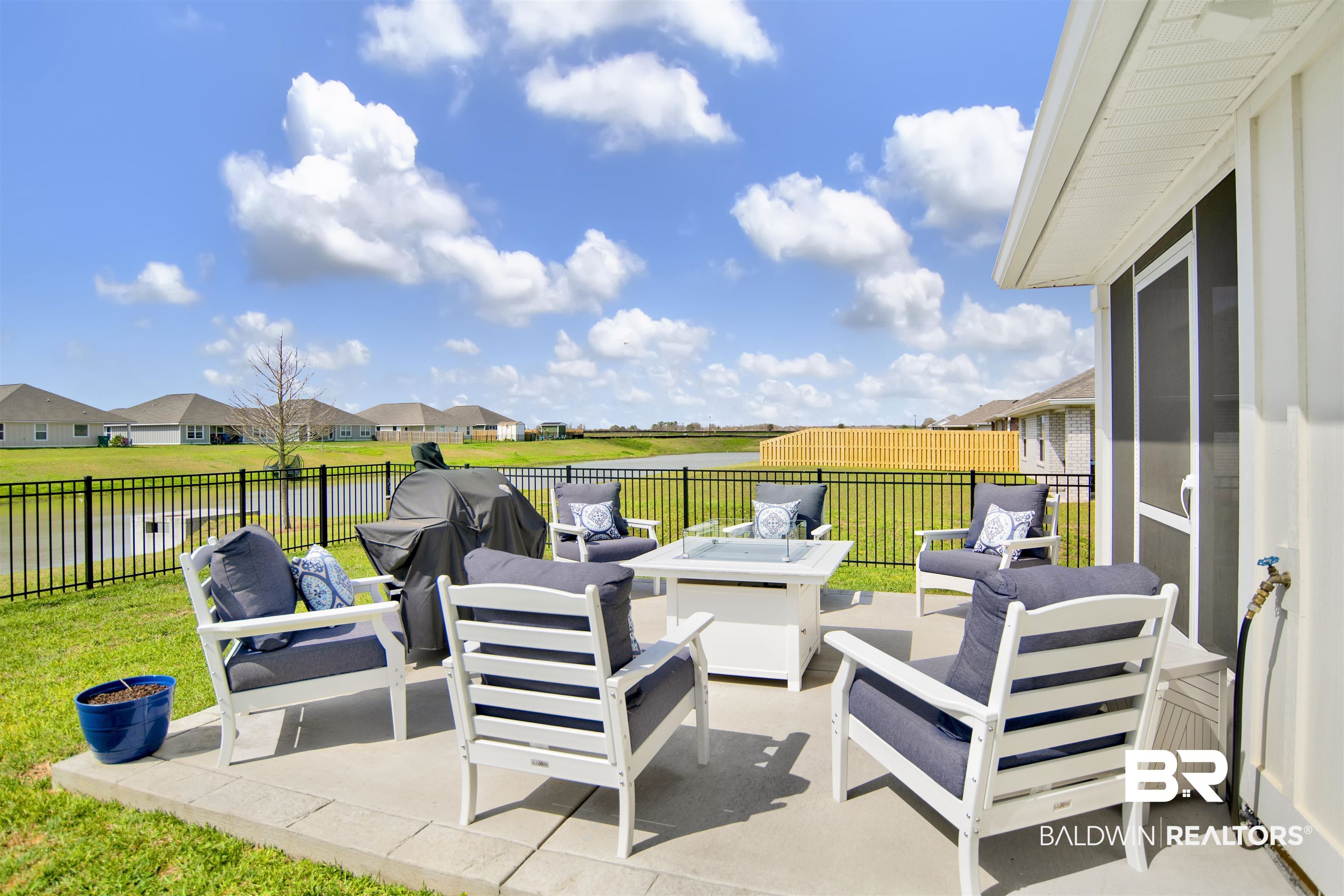 3097 Ingrid Lane Foley, AL 36535 - Photo 31 of 38 View of patio / terrace featuring an outdoor living space, a fenced backyard, and a residential view