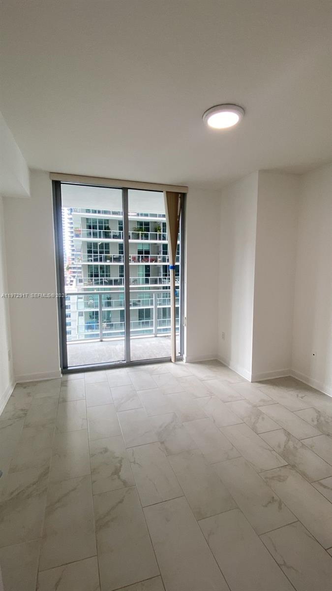 1111 Southwest 1st Avenue, Unit 2016N Miami, FL 33130 - Photo 10 of 20 a view of an empty room with a window
