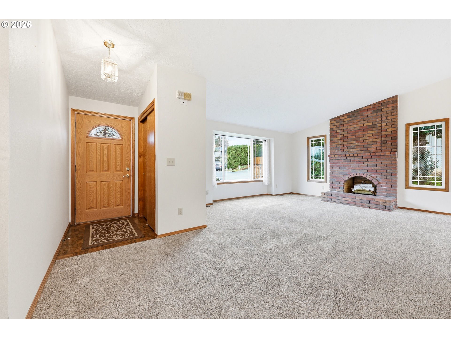 419 Southwest Day Court Gresham, OR 97080 - Photo 16 of 44 a view of a livingroom with a fireplace and a window