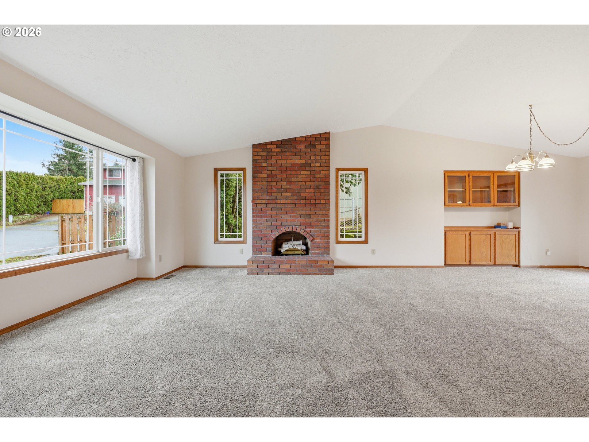 419 Southwest Day Court Gresham, OR 97080 - Photo 17 of 44 a view of empty room with windows and fireplace