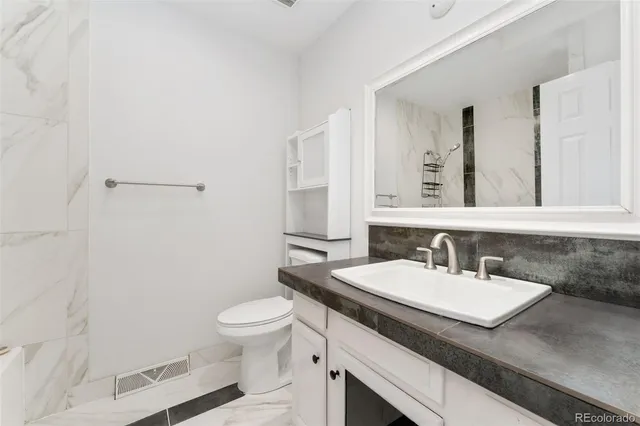 a view of a room with a black and white checkered floor